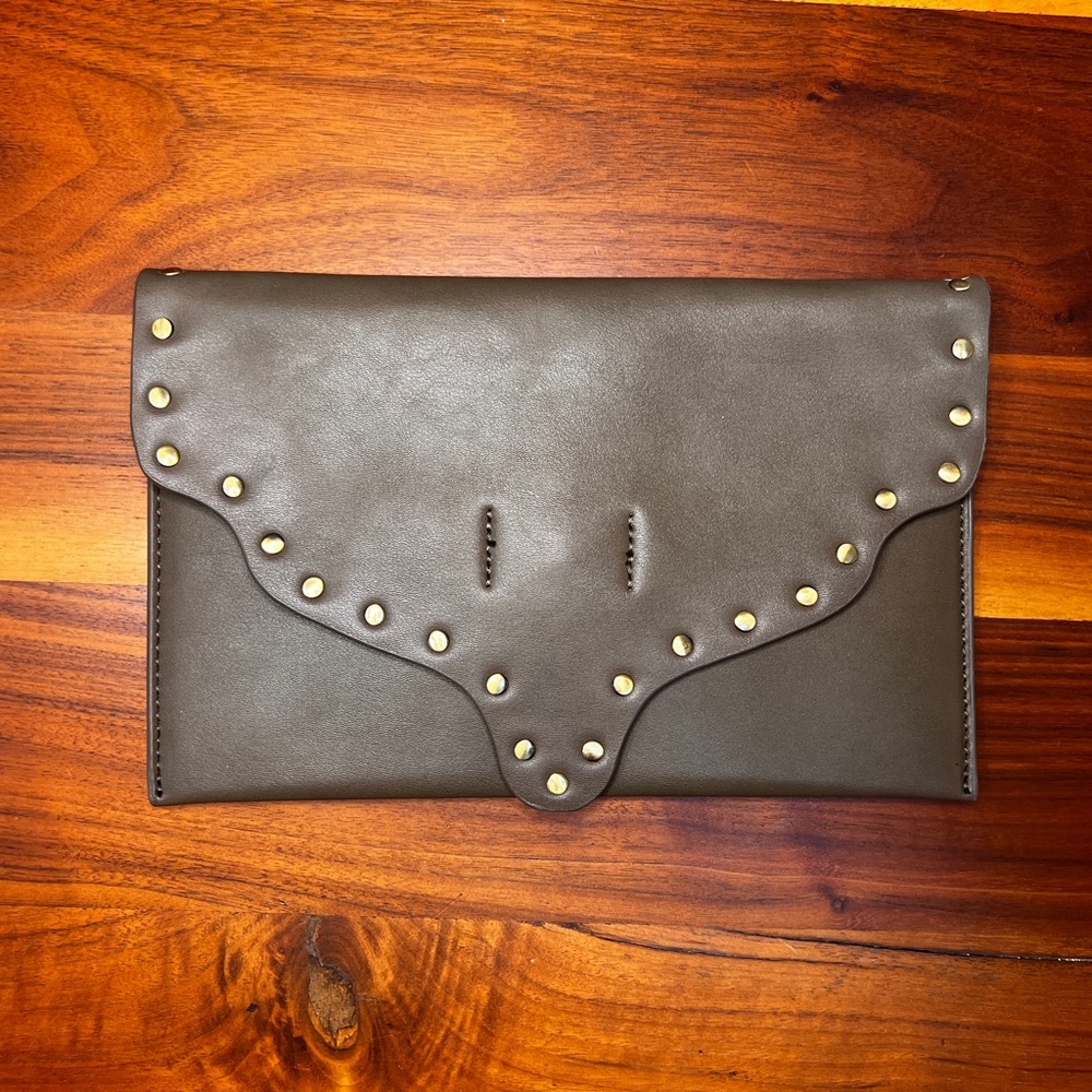 Brand new, faux leather clutch. Neutral grey with magnetic closure.